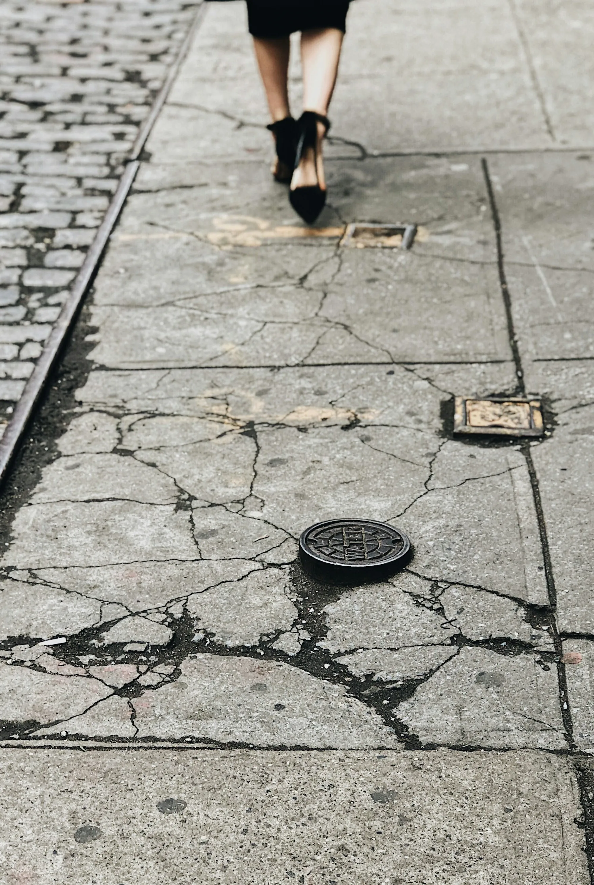 Cracked and worn concrete pavement